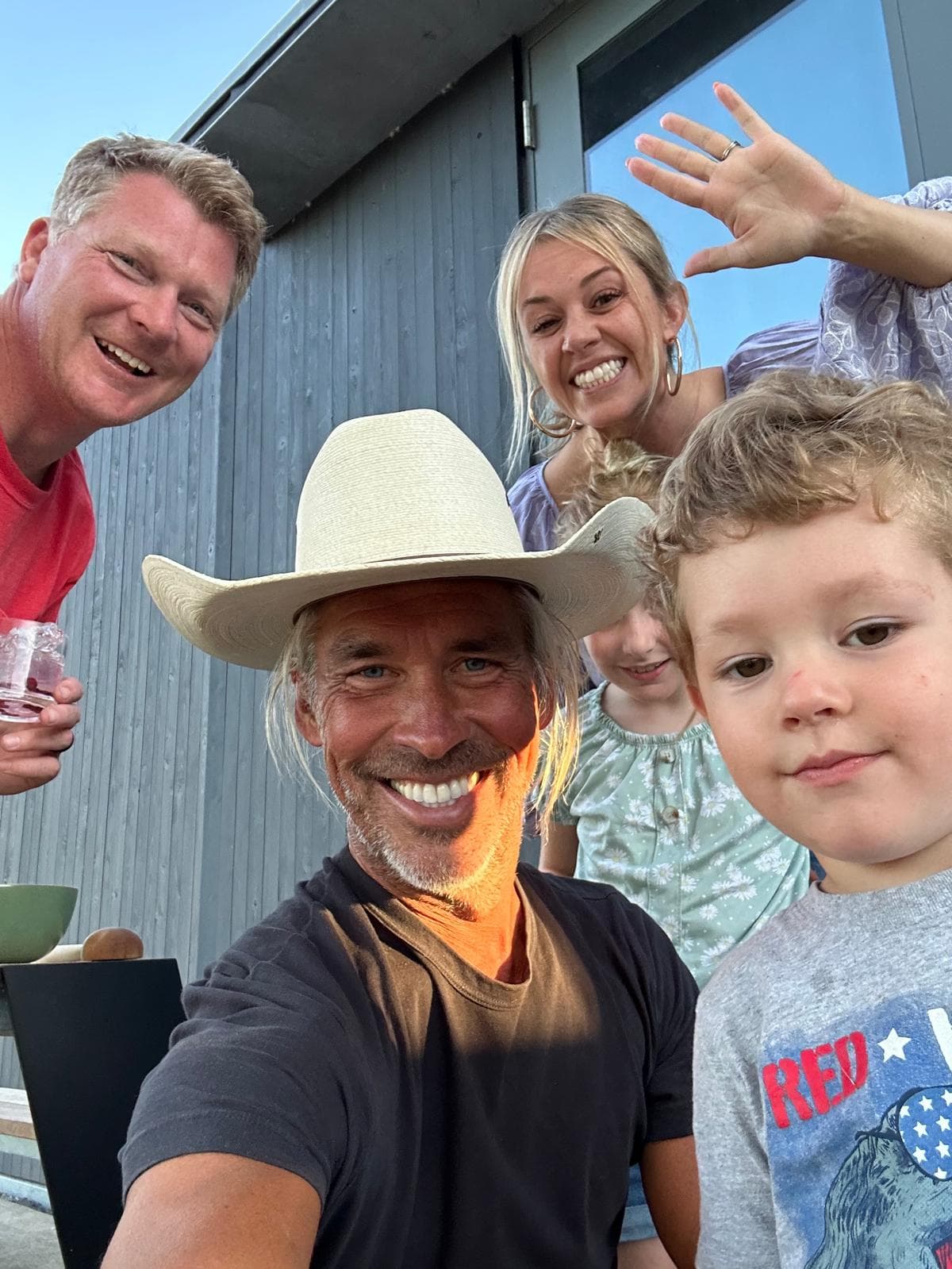 Lantz family sharing a smiling ranch portrait