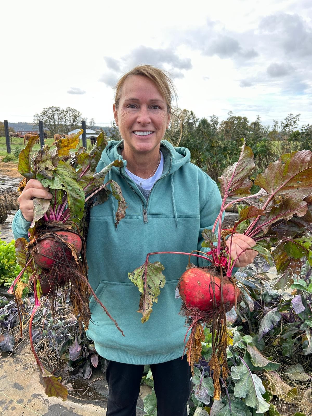 Robin Johnson sharing a quiet moment with a horse by the fence